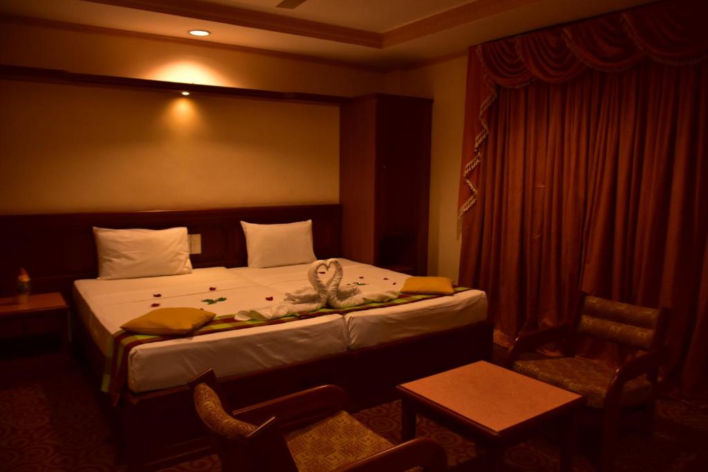 Postel nebo postele na pokoji v ubytování Hotel Lakefield