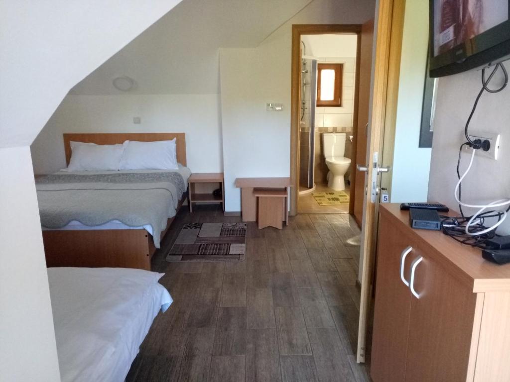 Postel nebo postele na pokoji v ubytování Vidra Parc