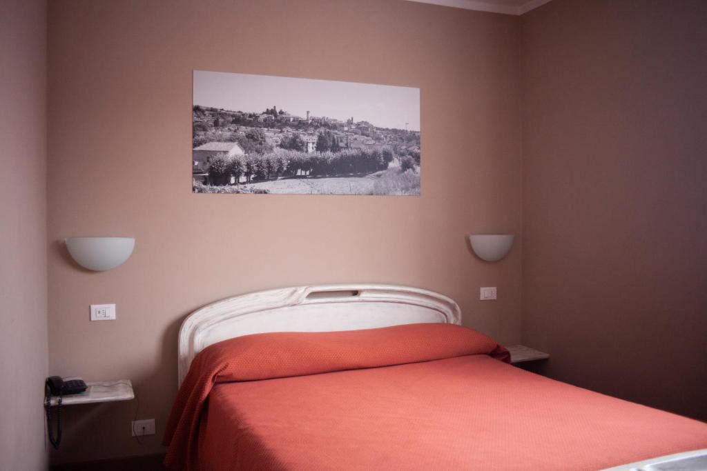 Postel nebo postele na pokoji v ubytování Hotel Ciocca