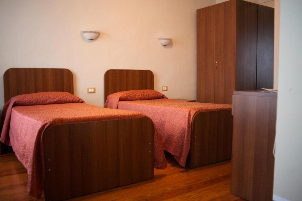 Postel nebo postele na pokoji v ubytování Hotel Ciocca