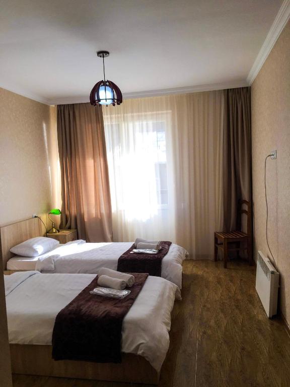 Postel nebo postele na pokoji v ubytování Family Hotel Kala