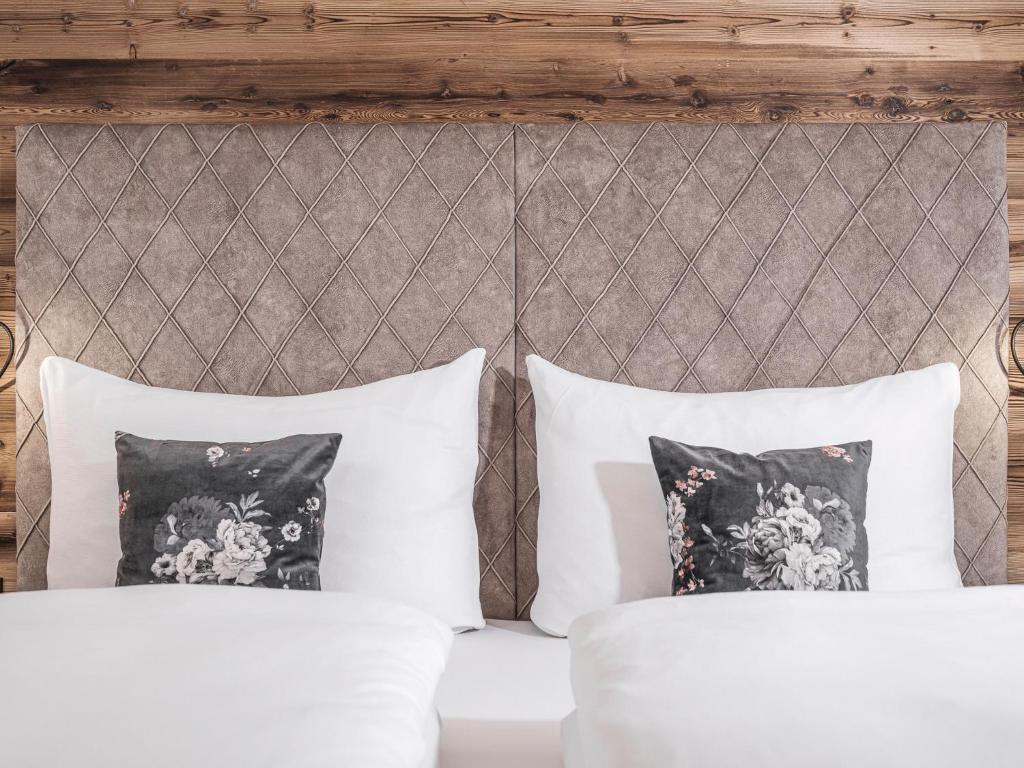 Posteľ alebo postele v izbe v ubytovaní Platzhirsch Apart & Mayrhofen