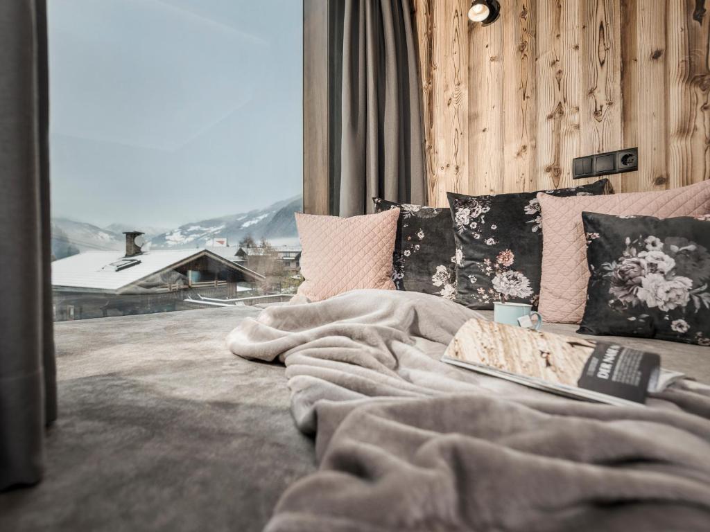 Posteľ alebo postele v izbe v ubytovaní Platzhirsch Apart & Mayrhofen
