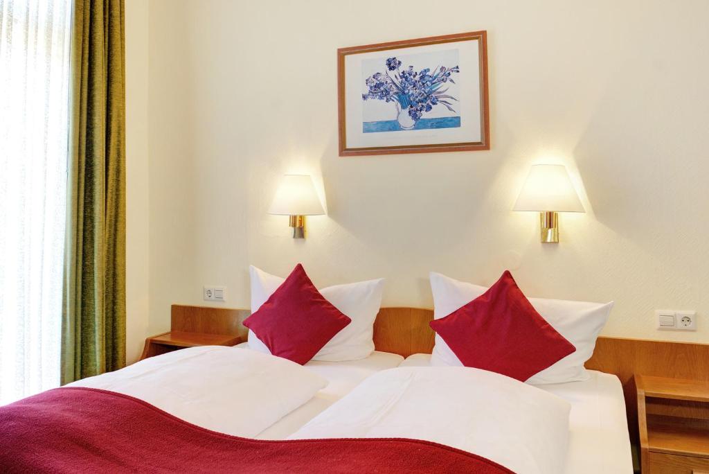 Postel nebo postele na pokoji v ubytování Hotel Fidelitas