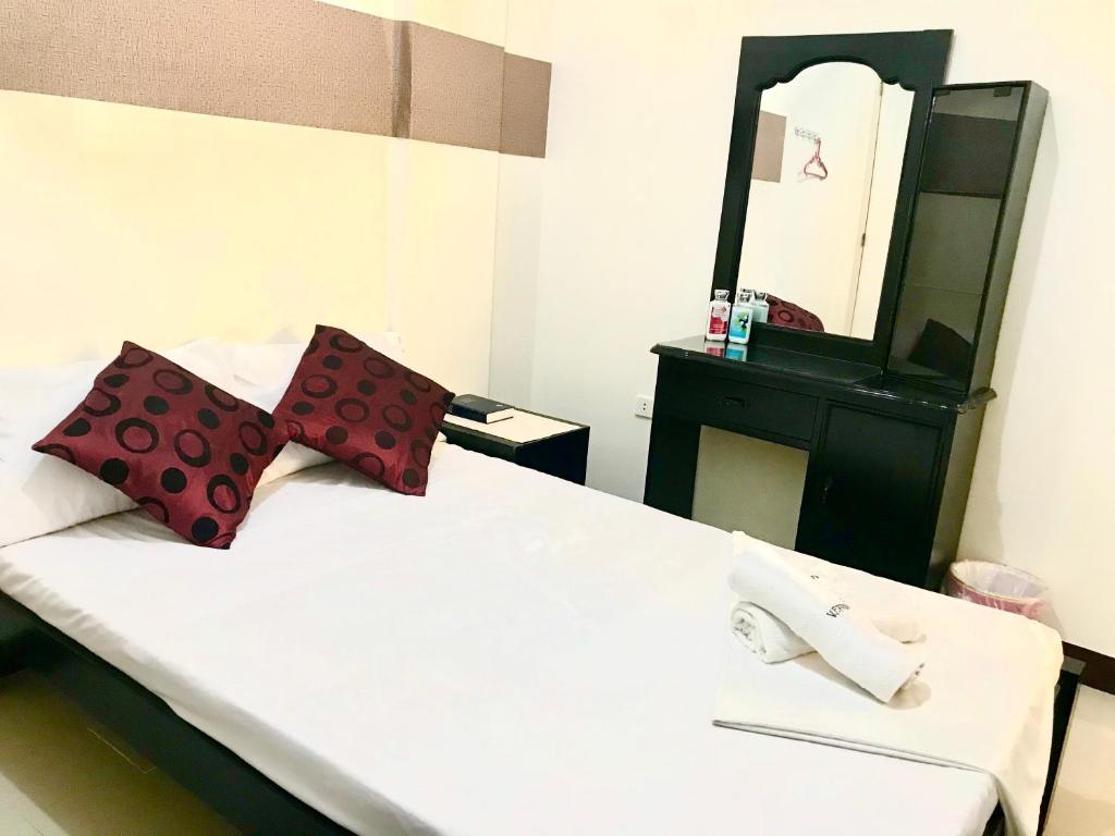 Postel nebo postele na pokoji v ubytování V.F. Riton Apartelle