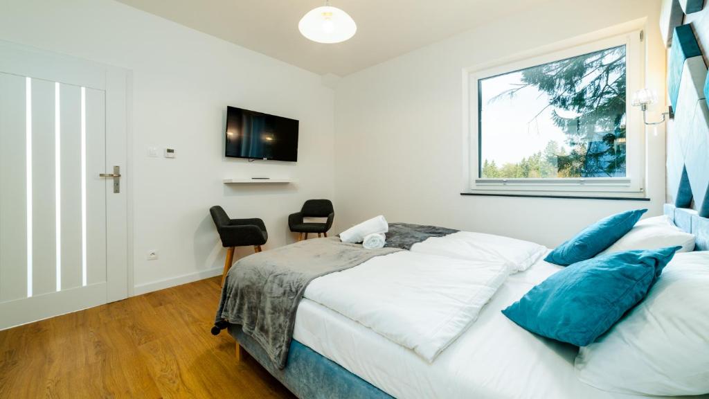 Posteľ alebo postele v izbe v ubytovaní Apartamenty EverySky - Wyspiańskiego 4