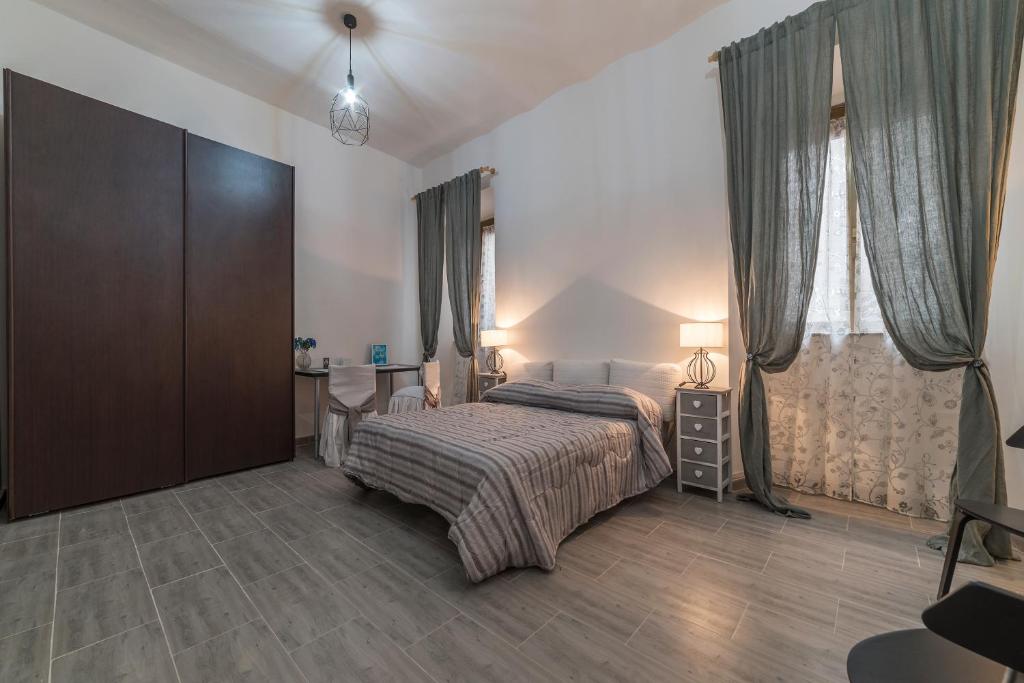 Łóżko lub łóżka w pokoju w obiekcie Ad un passo da Villa Borghese Apartment