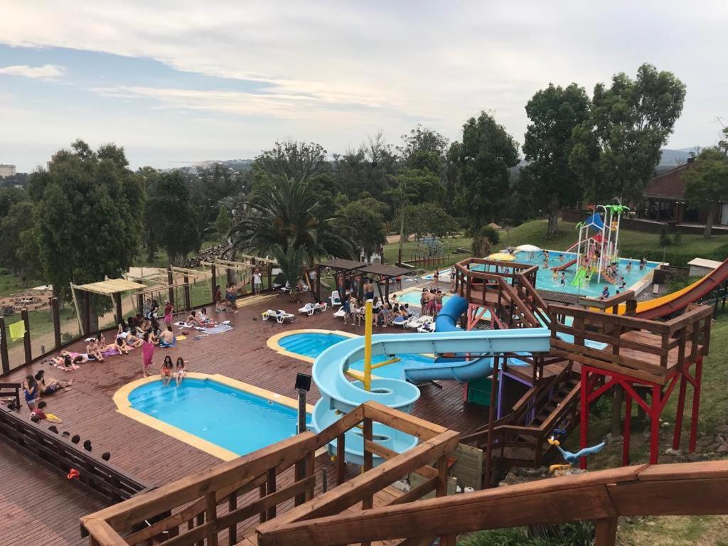 a group of people in a water park at Complejo Laderas del Cerro in Piriápolis