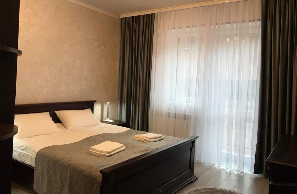 Postel nebo postele na pokoji v ubytování Сонячне Джерело