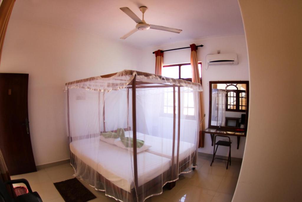 Postel nebo postele na pokoji v ubytování Angel Inn Guest House