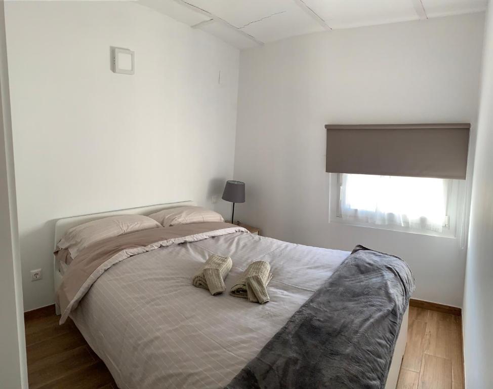 Posteľ alebo postele v izbe v ubytovaní APARTAMENTS IMPRO