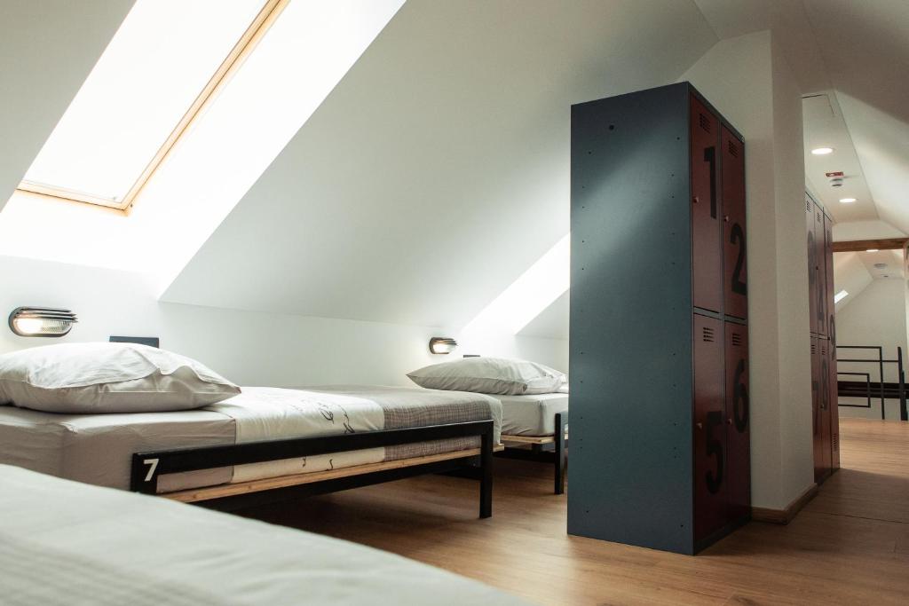 Postel nebo postele na pokoji v ubytování Hostel Vila Pohorje