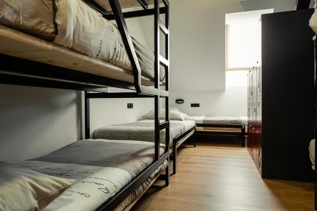 Postel nebo postele na pokoji v ubytování Hostel Vila Pohorje