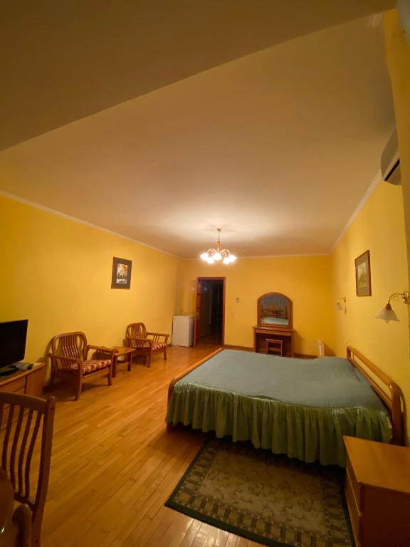 Postel nebo postele na pokoji v ubytování Hotel Obolon