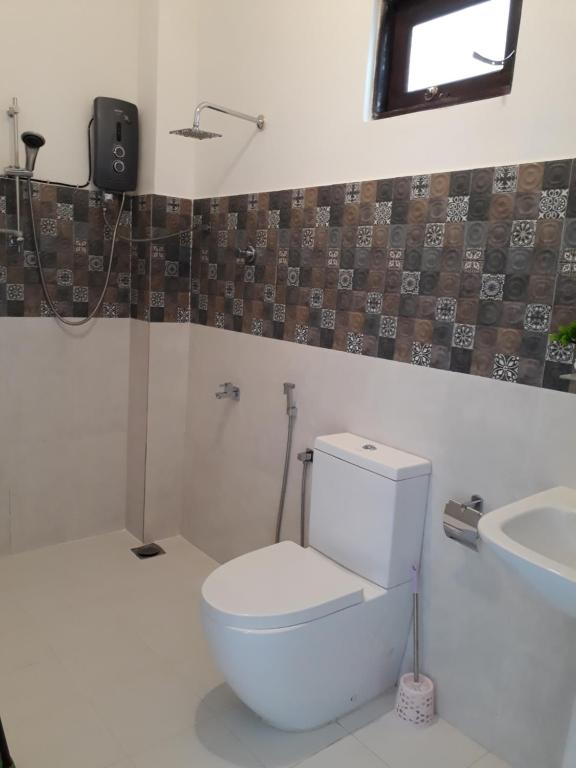 Koupelna v ubytování Apna Homestay Apartments