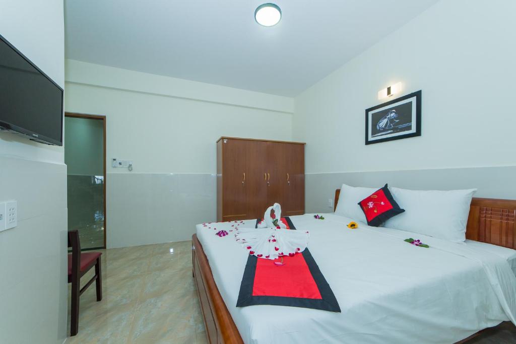 Postel nebo postele na pokoji v ubytování Coco Village Homestay Hoi An