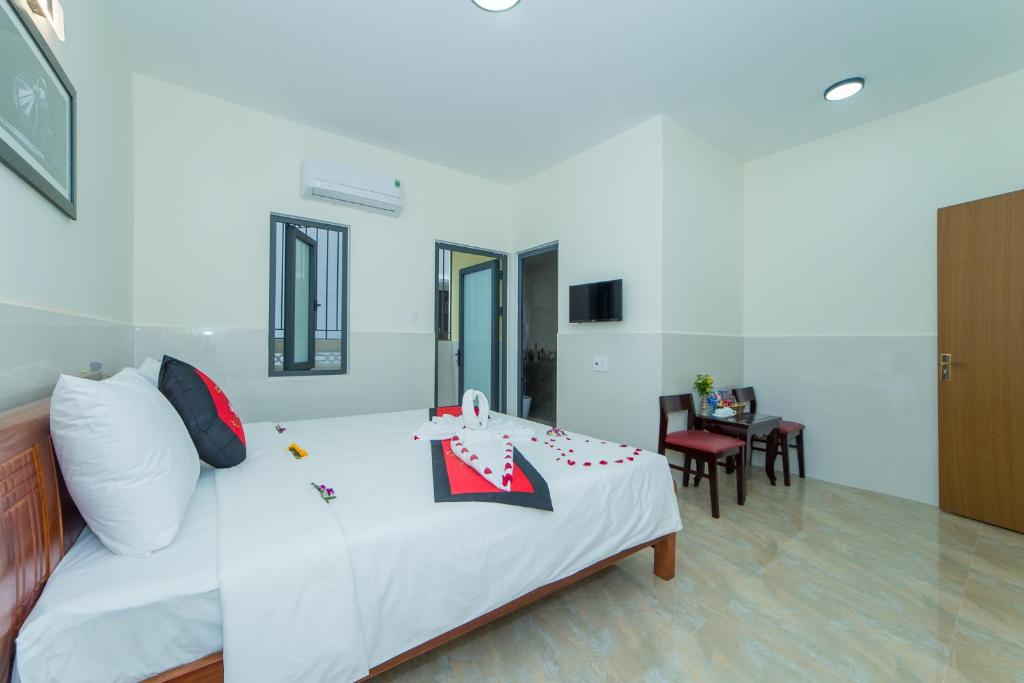 Postel nebo postele na pokoji v ubytování Coco Village Homestay Hoi An