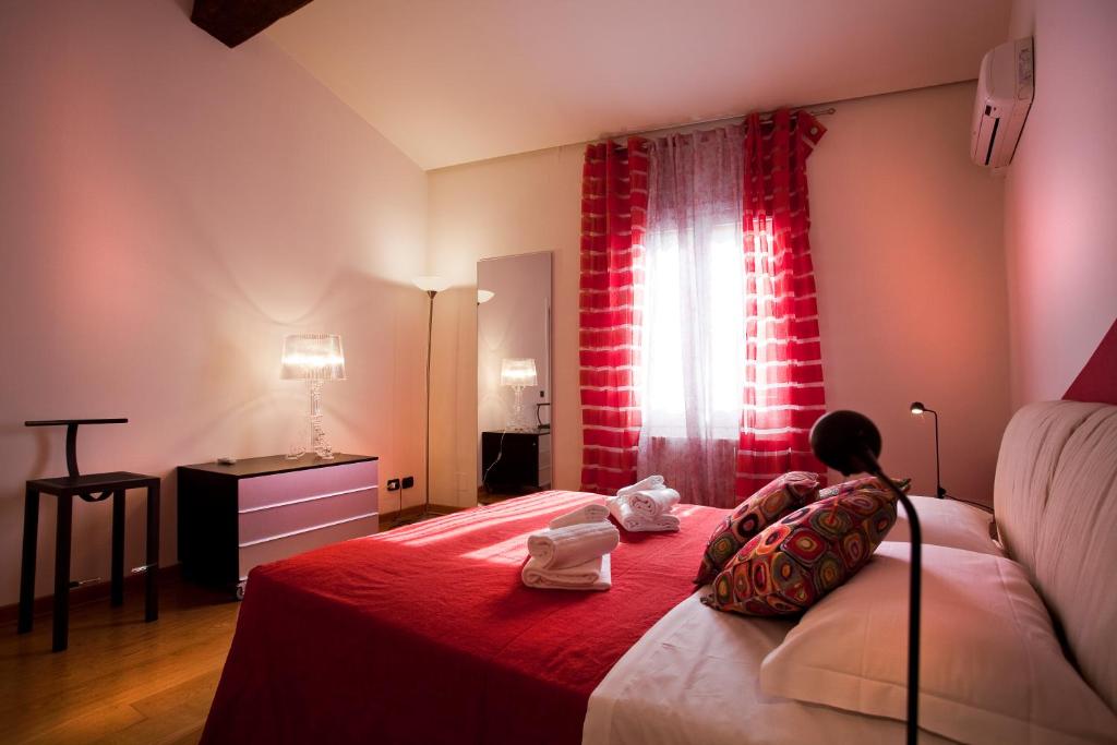 Letto o letti in una camera di FILARMONICO SUITES