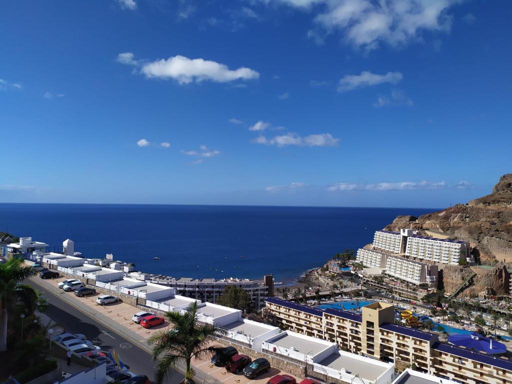 an aerial view of a resort and the ocean at Ocean view apartment in Taurito, Mogan - Top Floor in Taurito