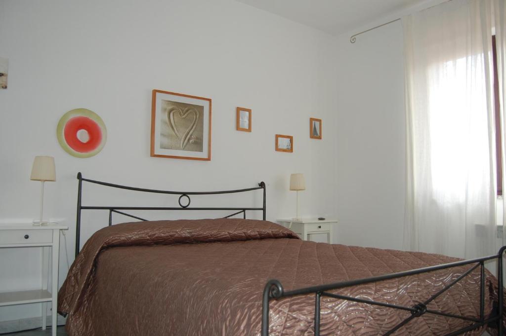 Postel nebo postele na pokoji v ubytování I Ginepri B&B