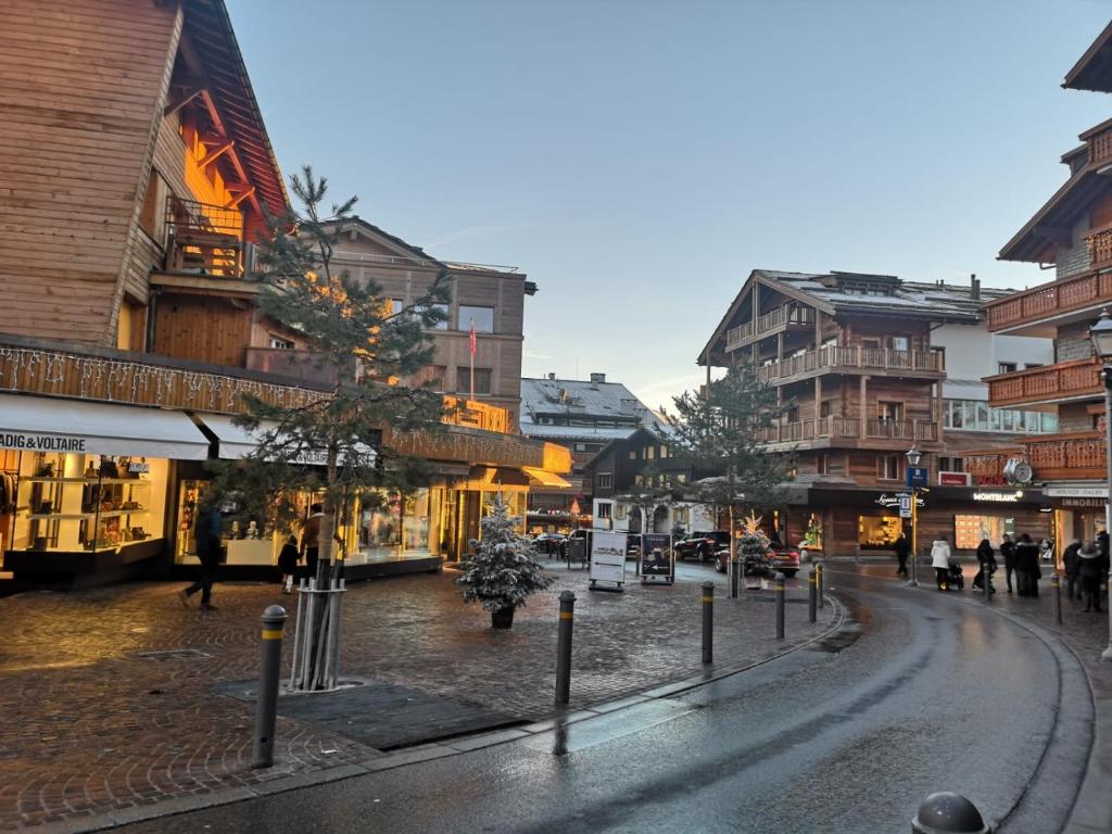 an empty street in a city with buildings at Apartment 32 Crans-Montana in Crans-Montana
