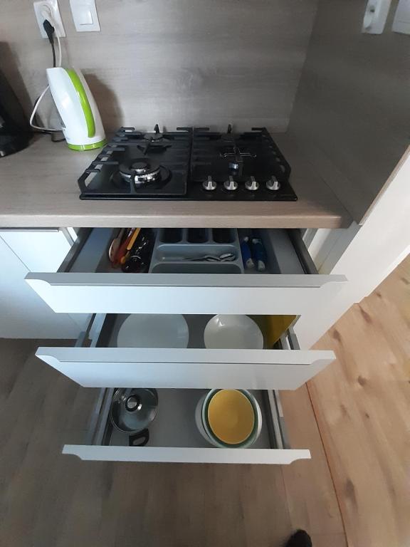 A kitchen or kitchenette at Apartment Klimka with balcony, free wifi and free parking
