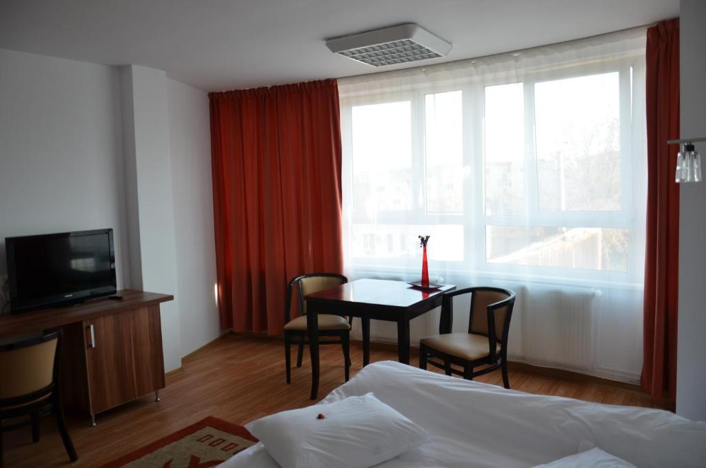 Postel nebo postele na pokoji v ubytování ApartHotel Zorilor