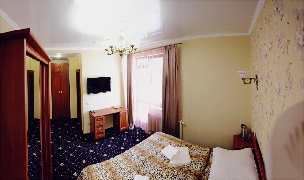 TV a/nebo společenská místnost v ubytování Hotel Afrodita