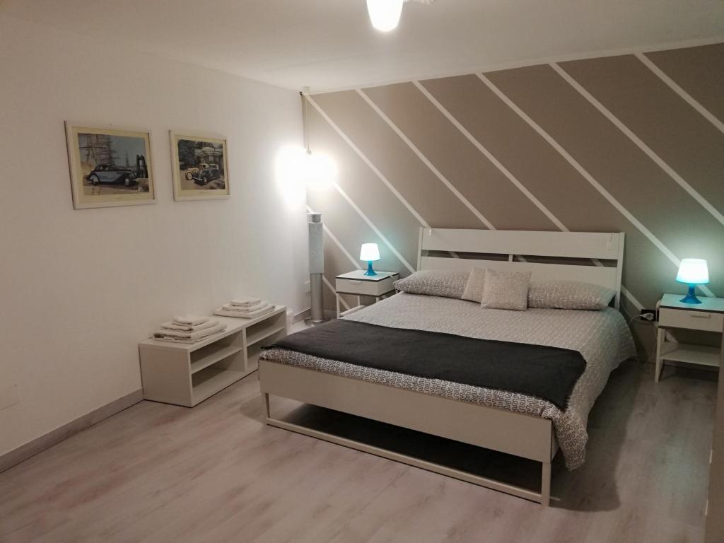 Postel nebo postele na pokoji v ubytování Palazzo Sant'Elia
