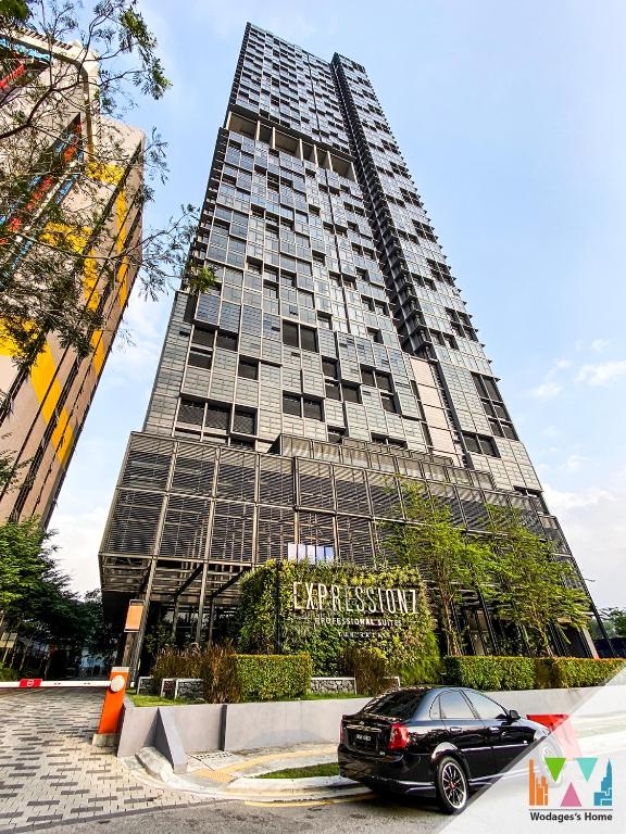 a car parked in front of a tall building at Expressionz KLCC by Wodages, 300mbps Wifi in Kuala Lumpur