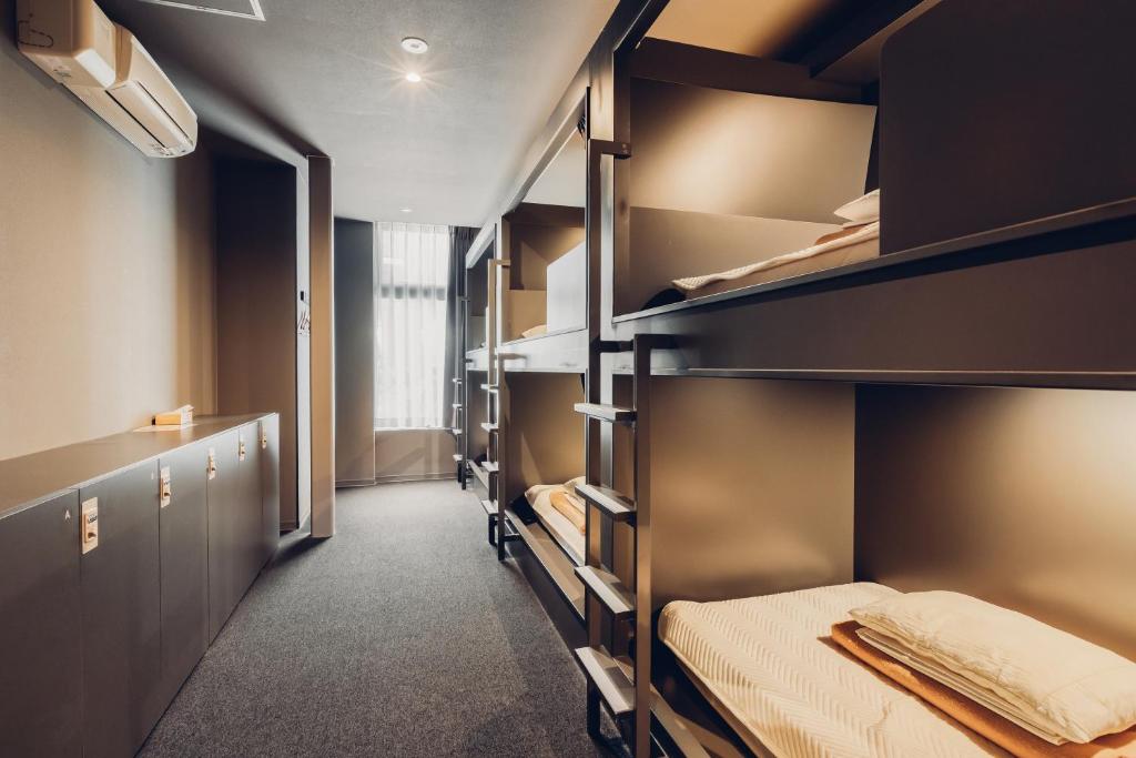 Postel nebo postele na pokoji v ubytování BON Hostel