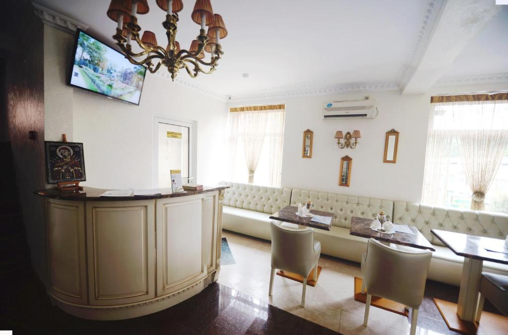 TV a/nebo společenská místnost v ubytování Hotel Afrodita