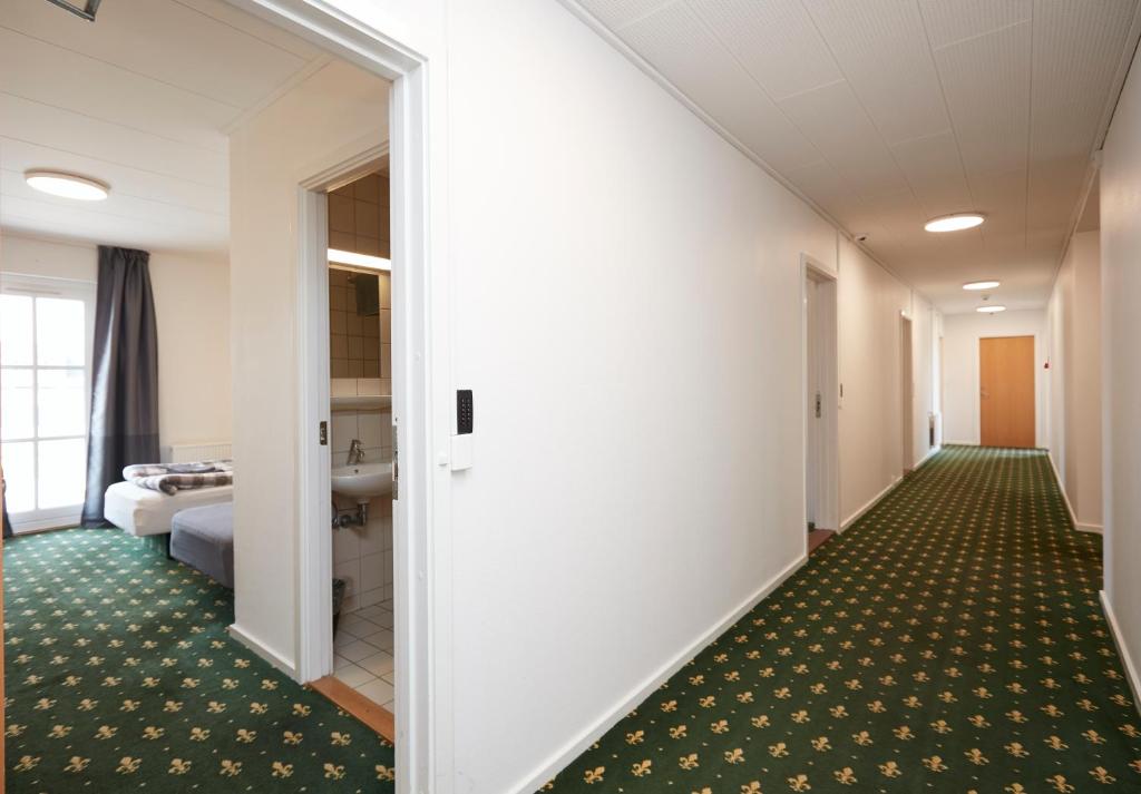 Postel nebo postele na pokoji v ubytování Hotel Osted