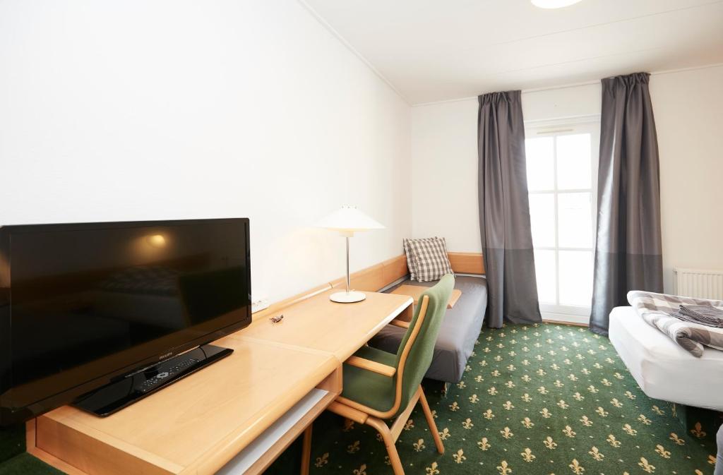 TV a/nebo společenská místnost v ubytování Hotel Osted