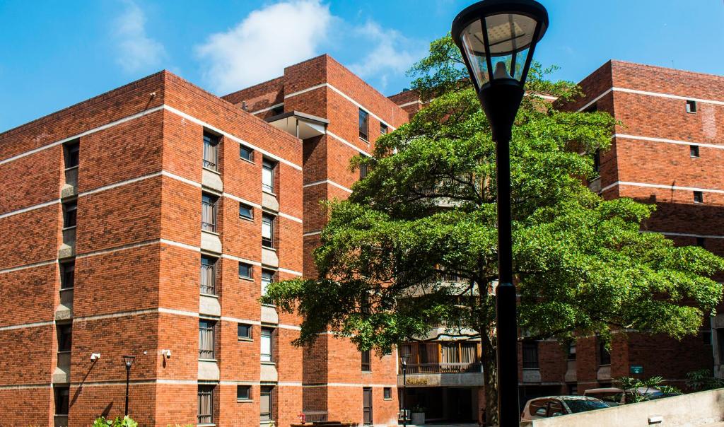 a brick building with a street light in front of it at Longonot Place Serviced Apartments in Nairobi