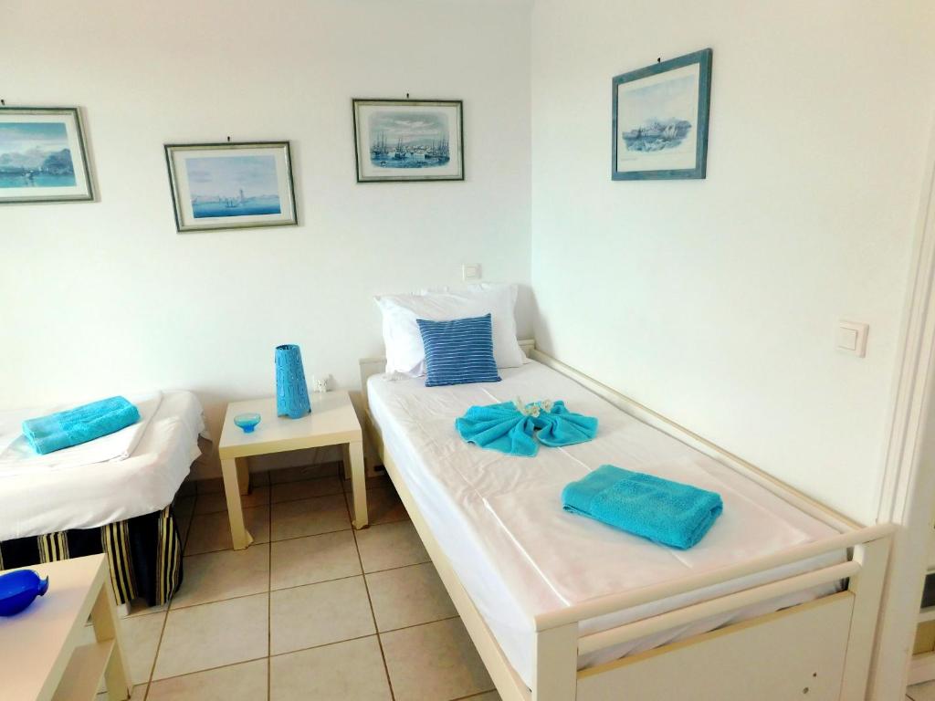 Posteľ alebo postele v izbe v ubytovaní Thalia Apartment