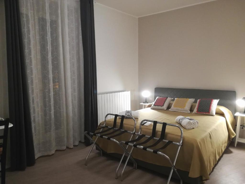 Łóżko lub łóżka w pokoju w obiekcie Persiane al Cassaro