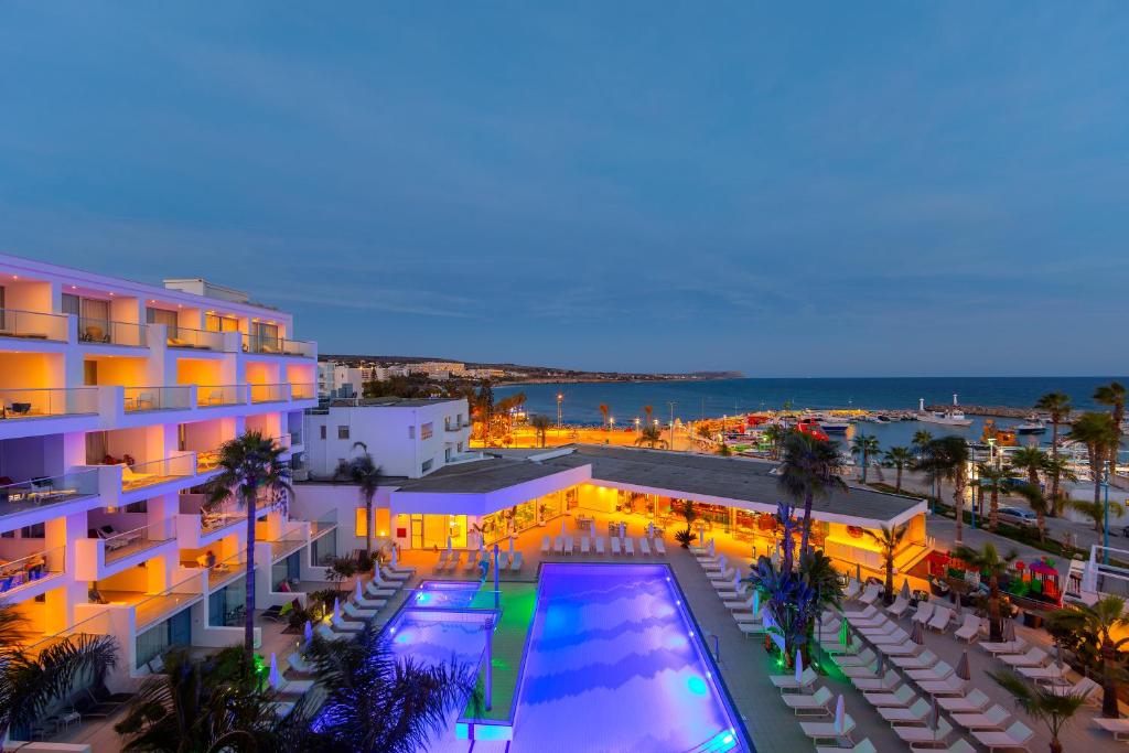 an aerial view of a hotel with a swimming pool at Limanaki Beach Hotel & Suites in Ayia Napa