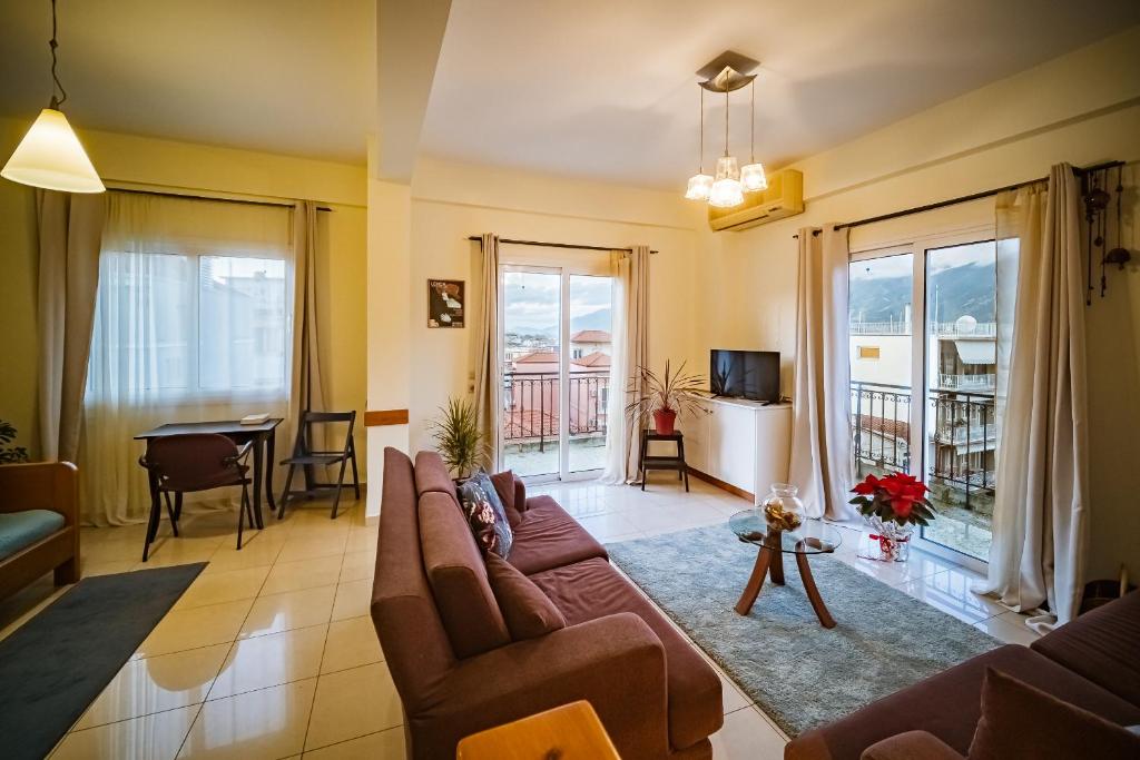 a living room with a couch and a table at 2 Bedrooms-Perfect Center Location-Amazing View in Ioannina