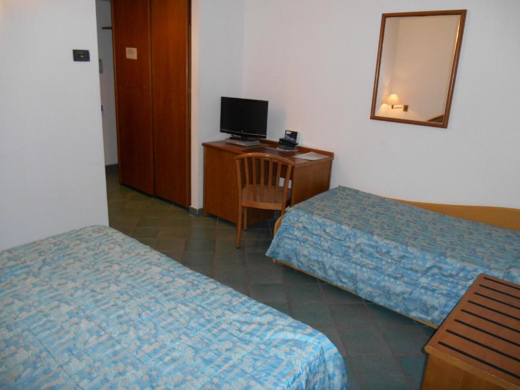 Postel nebo postele na pokoji v ubytování Hotel Pagnani