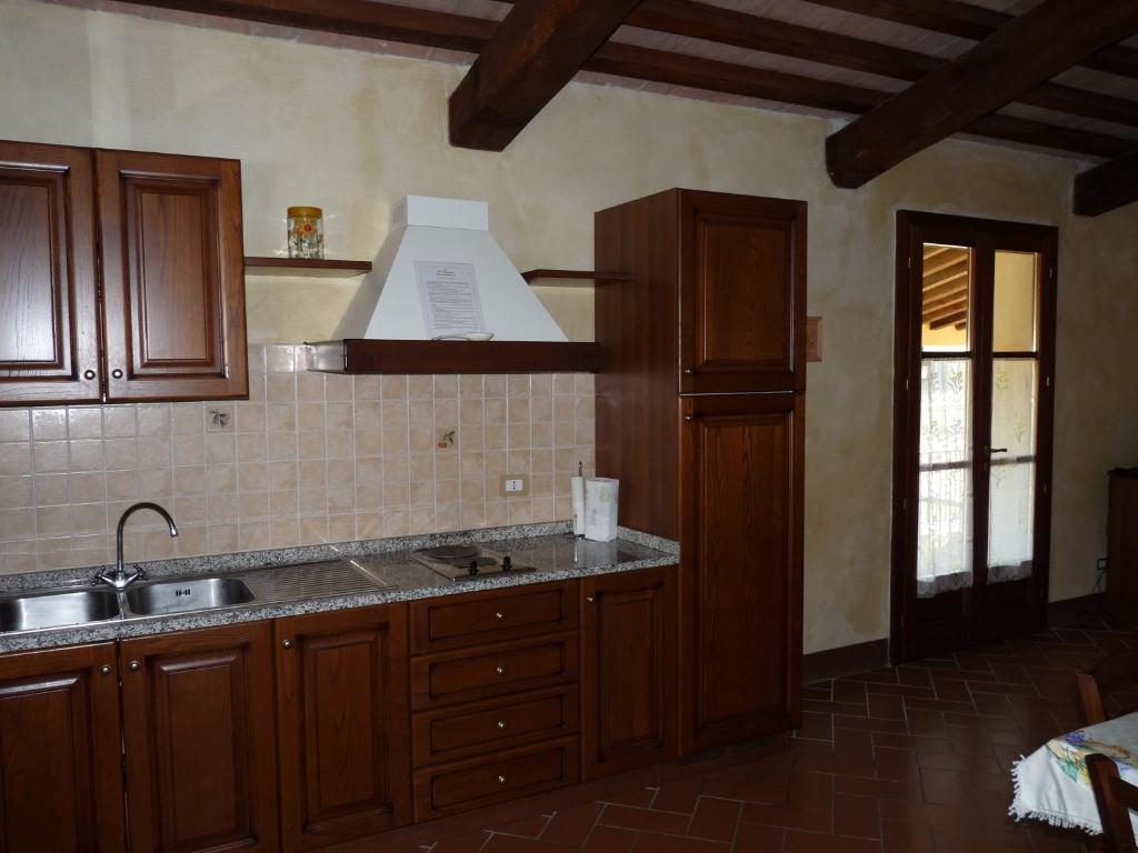 Kuchyň nebo kuchyňský kout v ubytování Residence Il Monastero