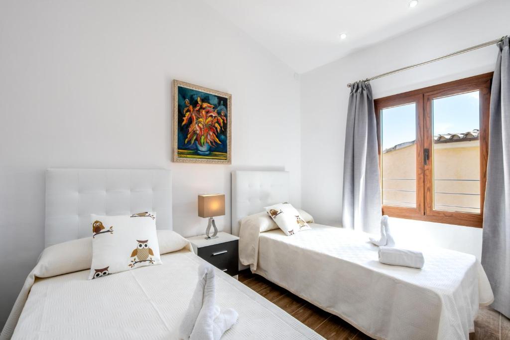 Postel nebo postele na pokoji v ubytování Villa Horta 55