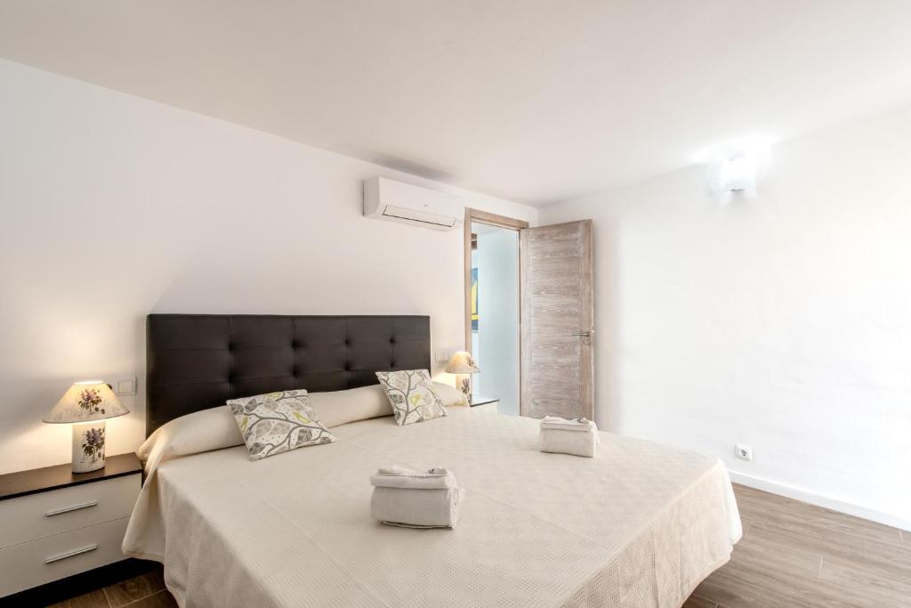 Postel nebo postele na pokoji v ubytování Villa Horta 55