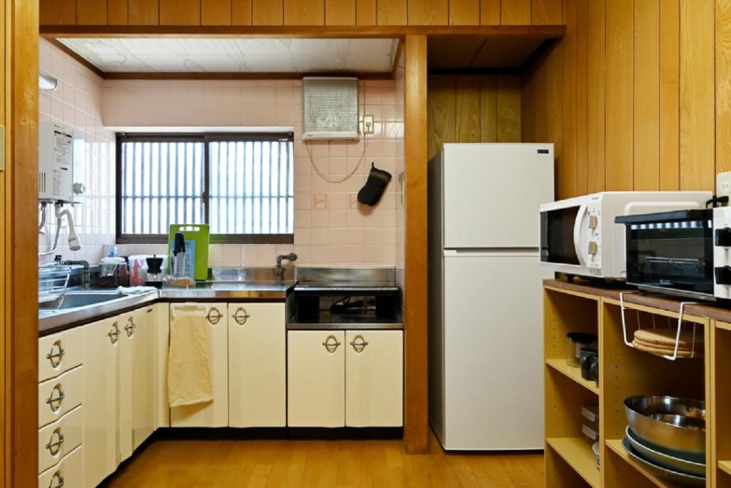 Kuchyň nebo kuchyňský kout v ubytování Yuzan apartment Sanjo