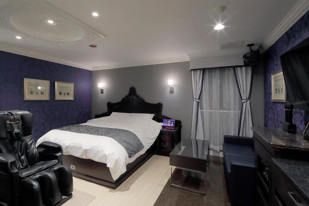 Postel nebo postele na pokoji v ubytování HOTEL Birthday 楠店