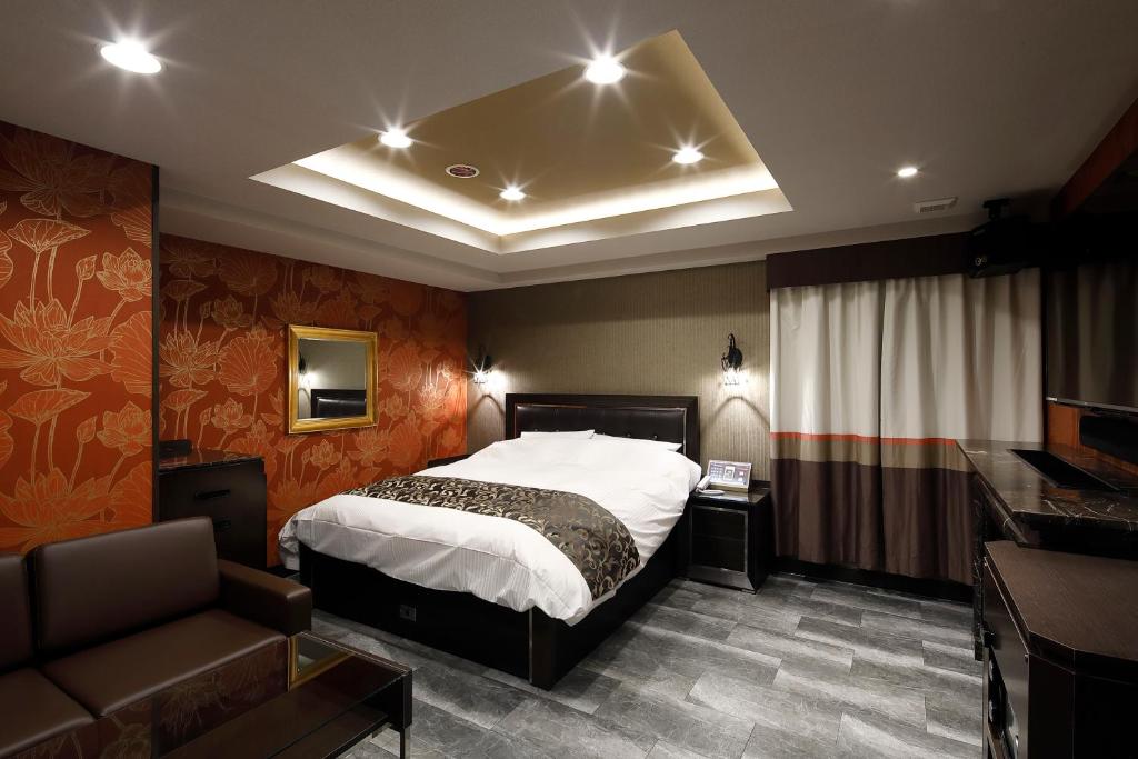 Postel nebo postele na pokoji v ubytování HOTEL Birthday 楠店