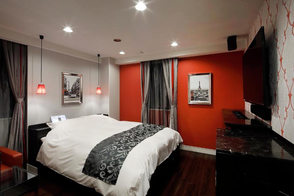 Postel nebo postele na pokoji v ubytování HOTEL Birthday 楠店