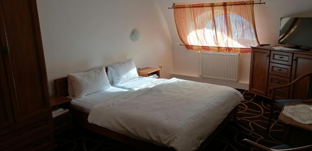 Postel nebo postele na pokoji v ubytování Pension Magnolia