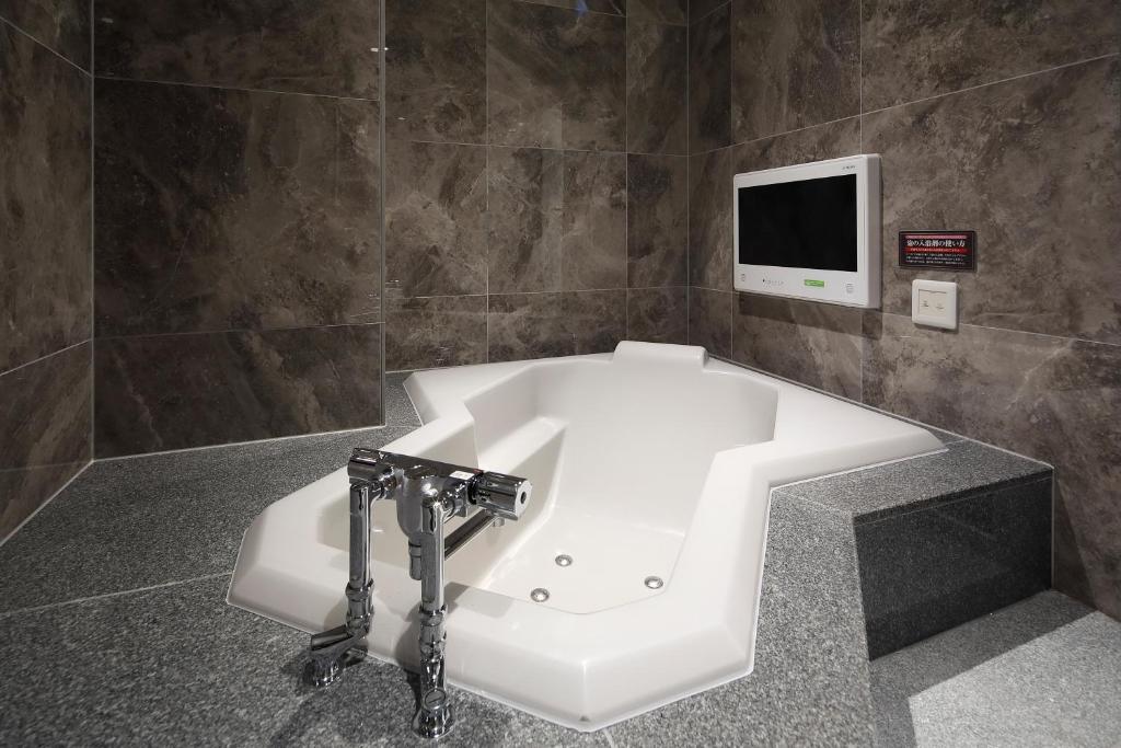 TV a/nebo společenská místnost v ubytování HOTEL Birthday 楠店