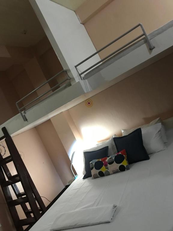 Postel nebo postele na pokoji v ubytování Palompon lodge